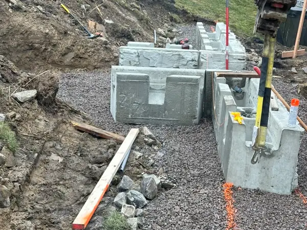 First Magnum Stone blocks set on a gravel base with a level