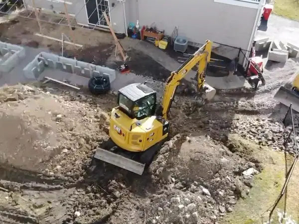 Aerial view of the work area with the first wall courses in place