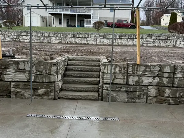 Finished two tier wall with center steps, seen from the slab