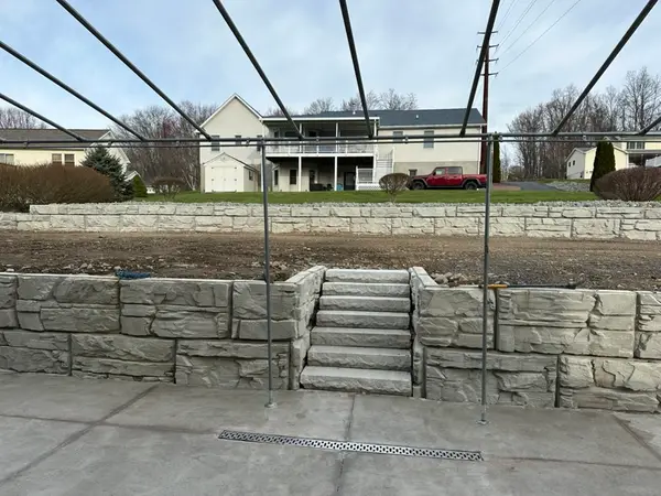 Finished wall and steps with a trench drain in the new slab